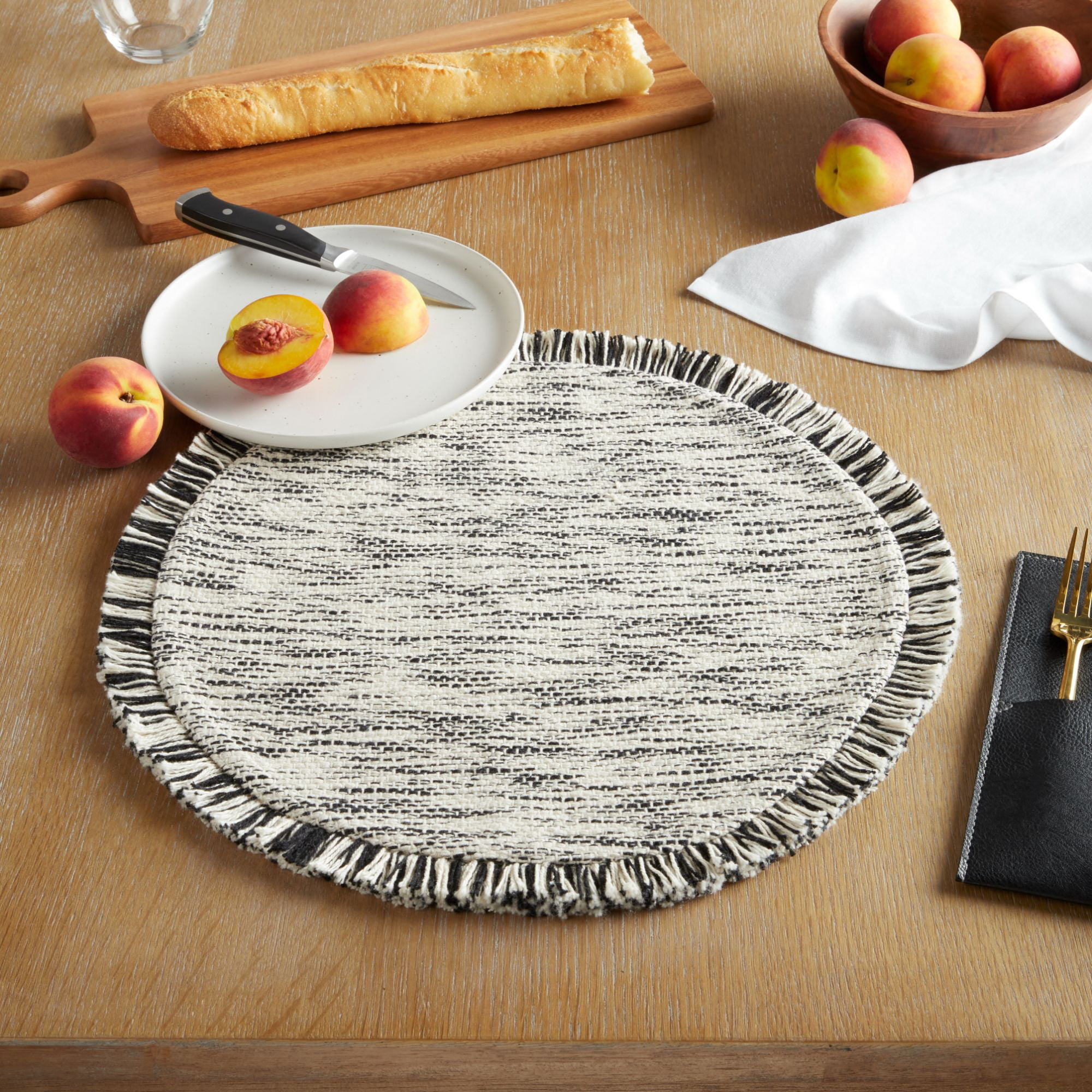 the placemat which is a cream and black heathered pattern