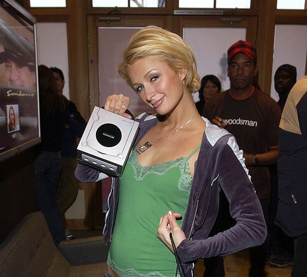 Paris Hilton holding a GameCube