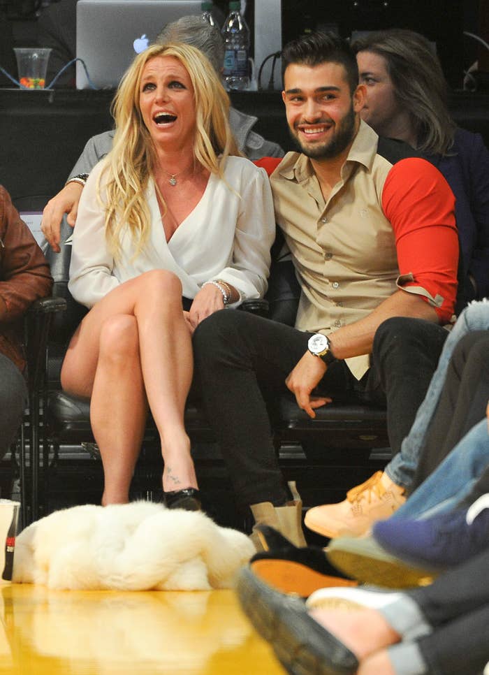 The former couple sitting courtside at a basketball game