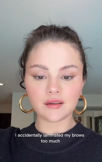 Close-up of Selena with the caption &quot;I accidentally laminated my brows too much&quot;