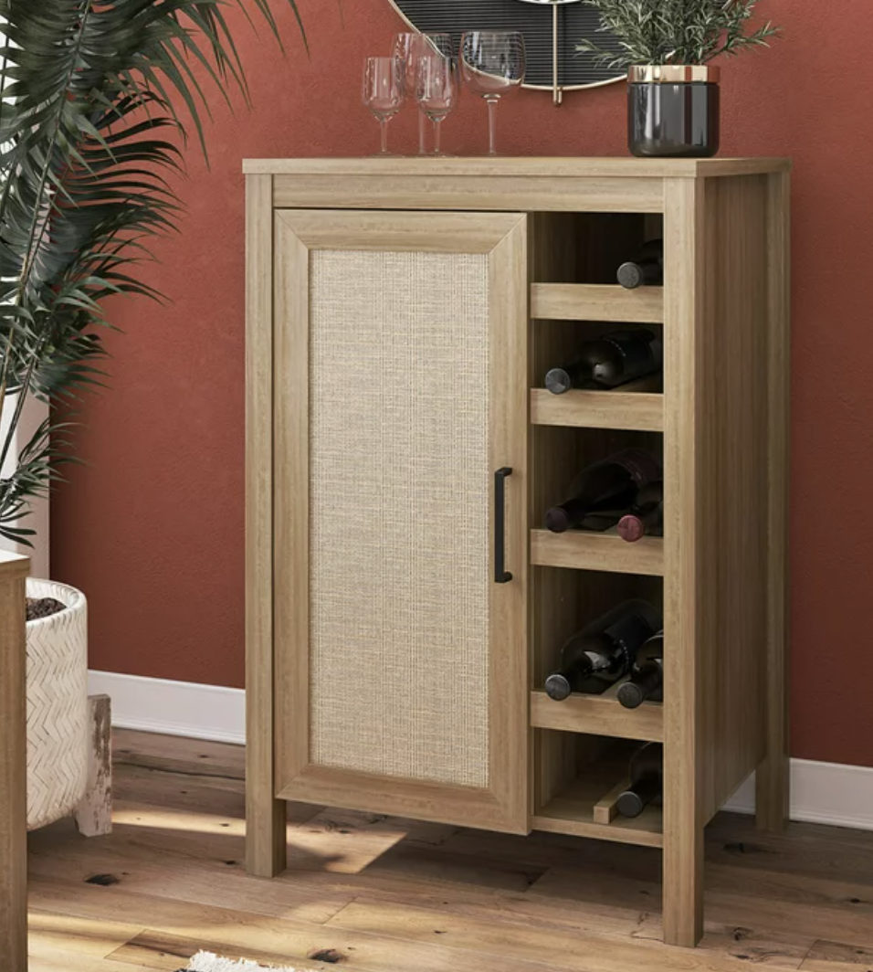 the beige rattan bar cabinet with shelves for bottles on the side