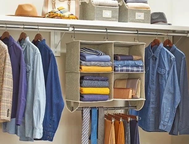 Hanging organizer with clothes inside it in a closet