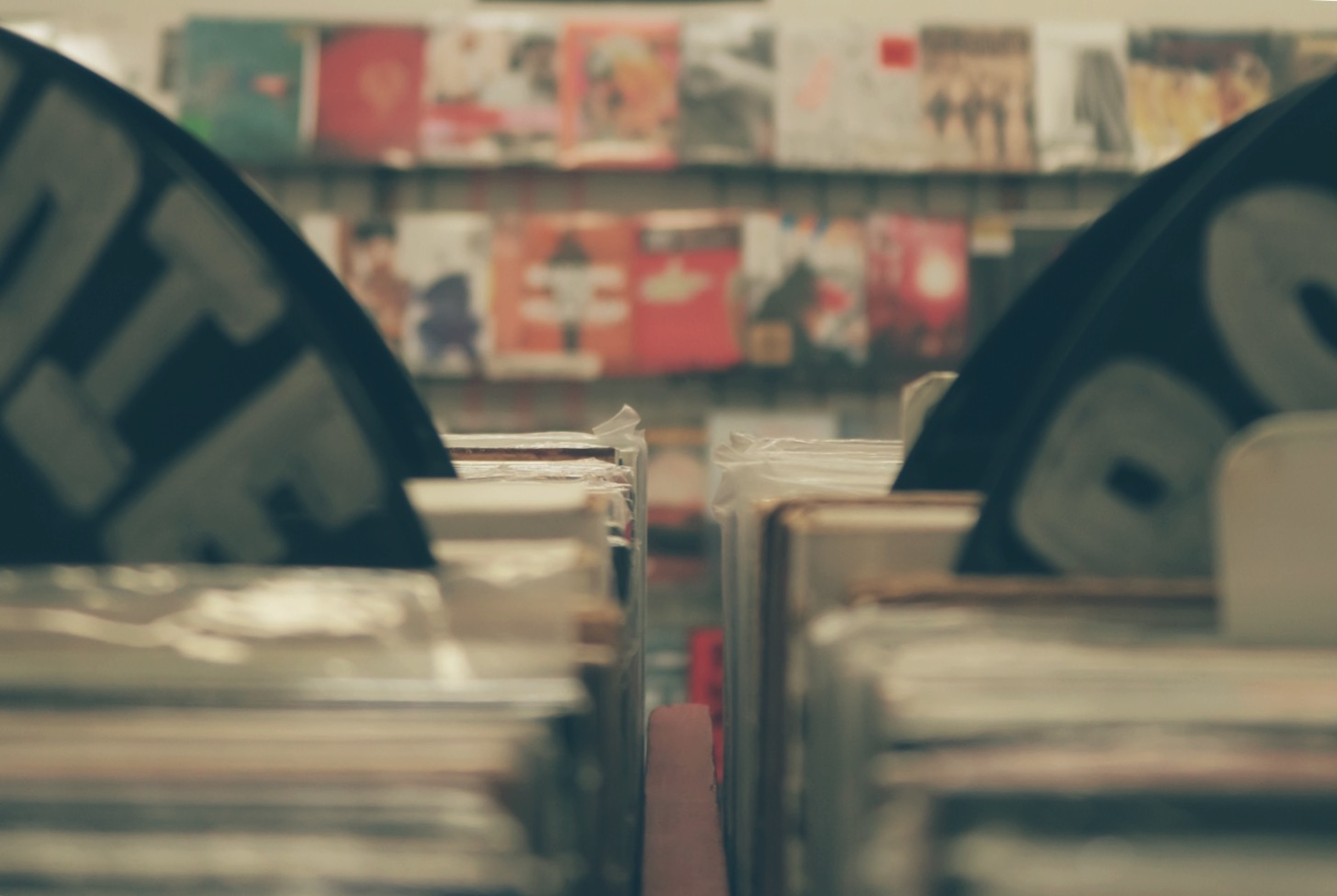 A view of what it looks like between stacks of vinyls at a record store