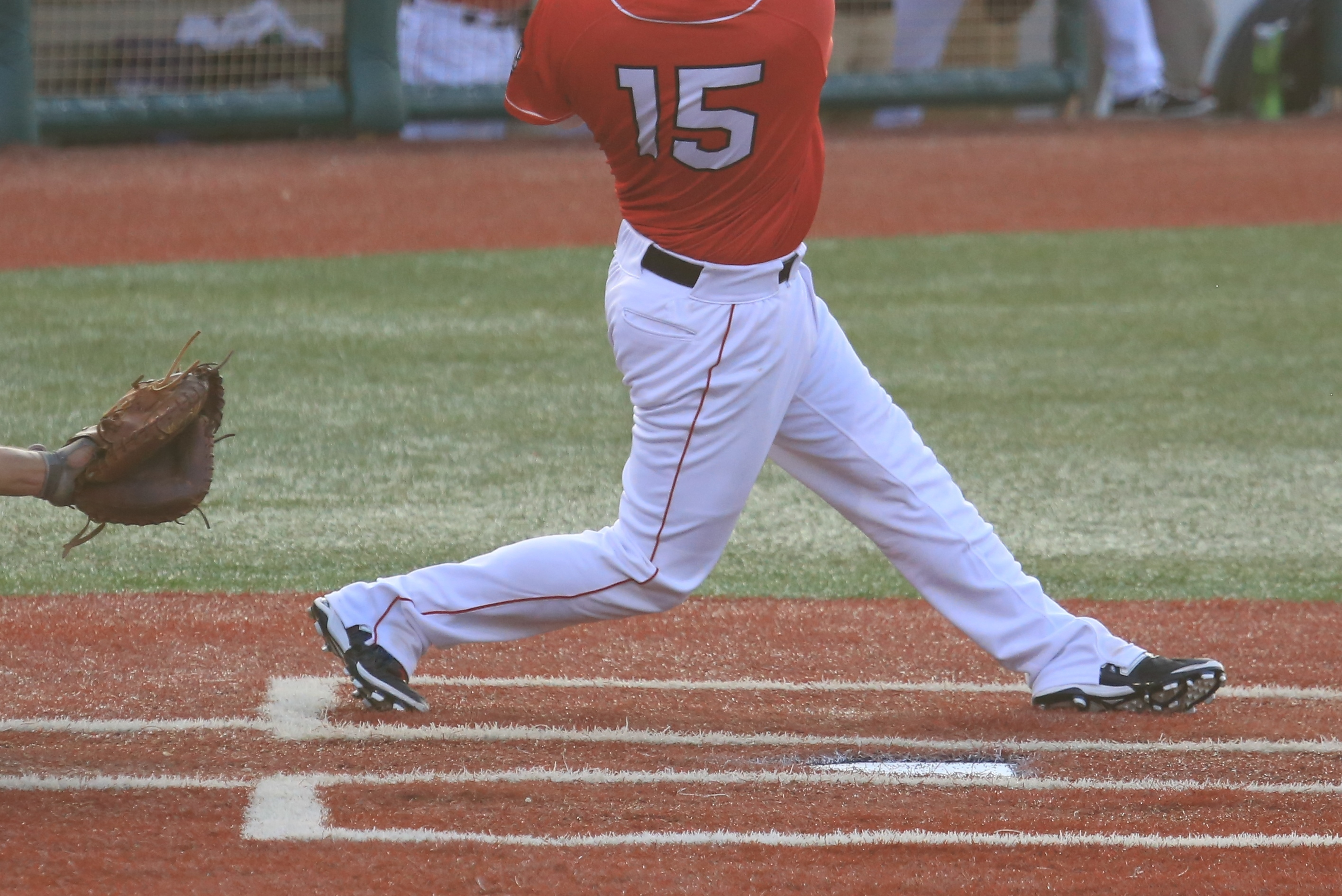 A baseball player is playing on the field