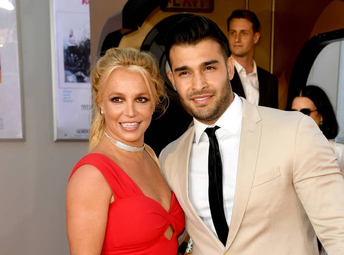 Closeup of Britney Spears and Sam Asghari smiling for the cameras at an event