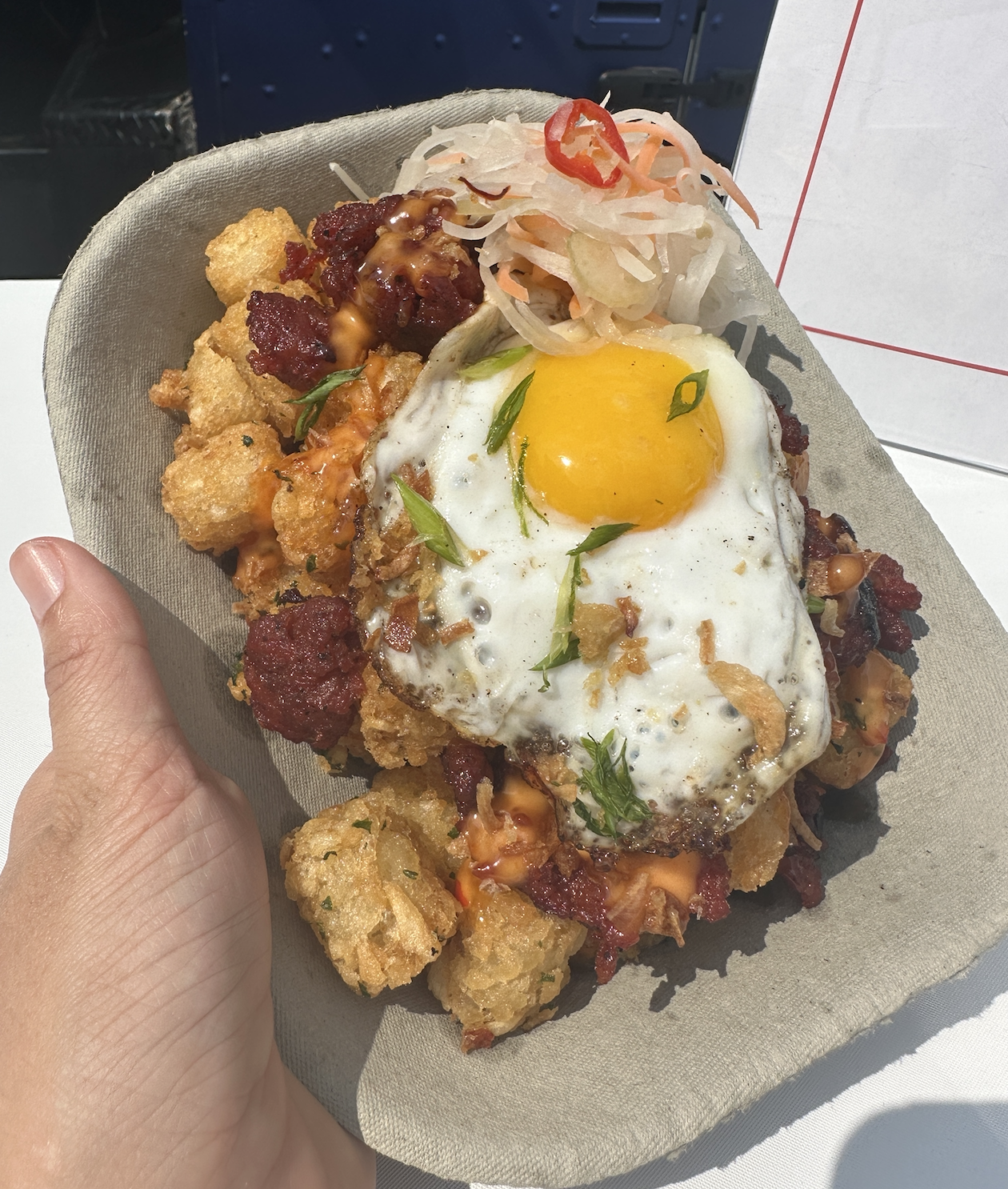 tater tots with an egg on top