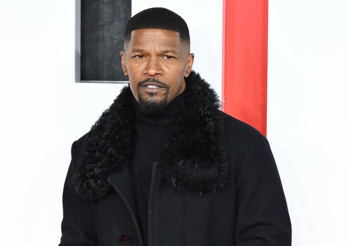 Jamie Foxx on the red carpet in turtleneck and coat