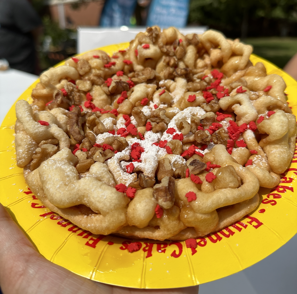 funnel cake topped with maple leaf confetti