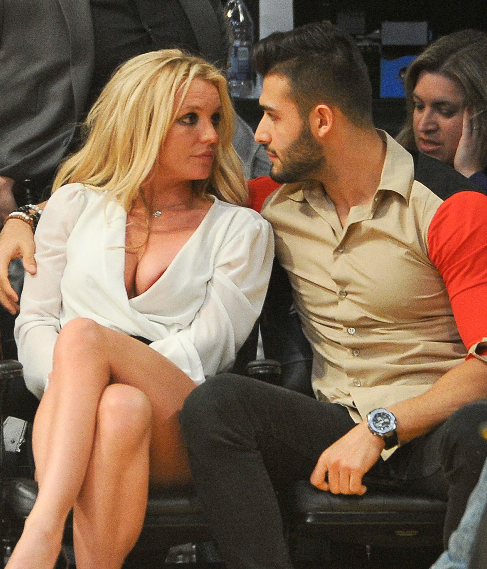 Close-up of Britney and Sam sitting together and looking at each other