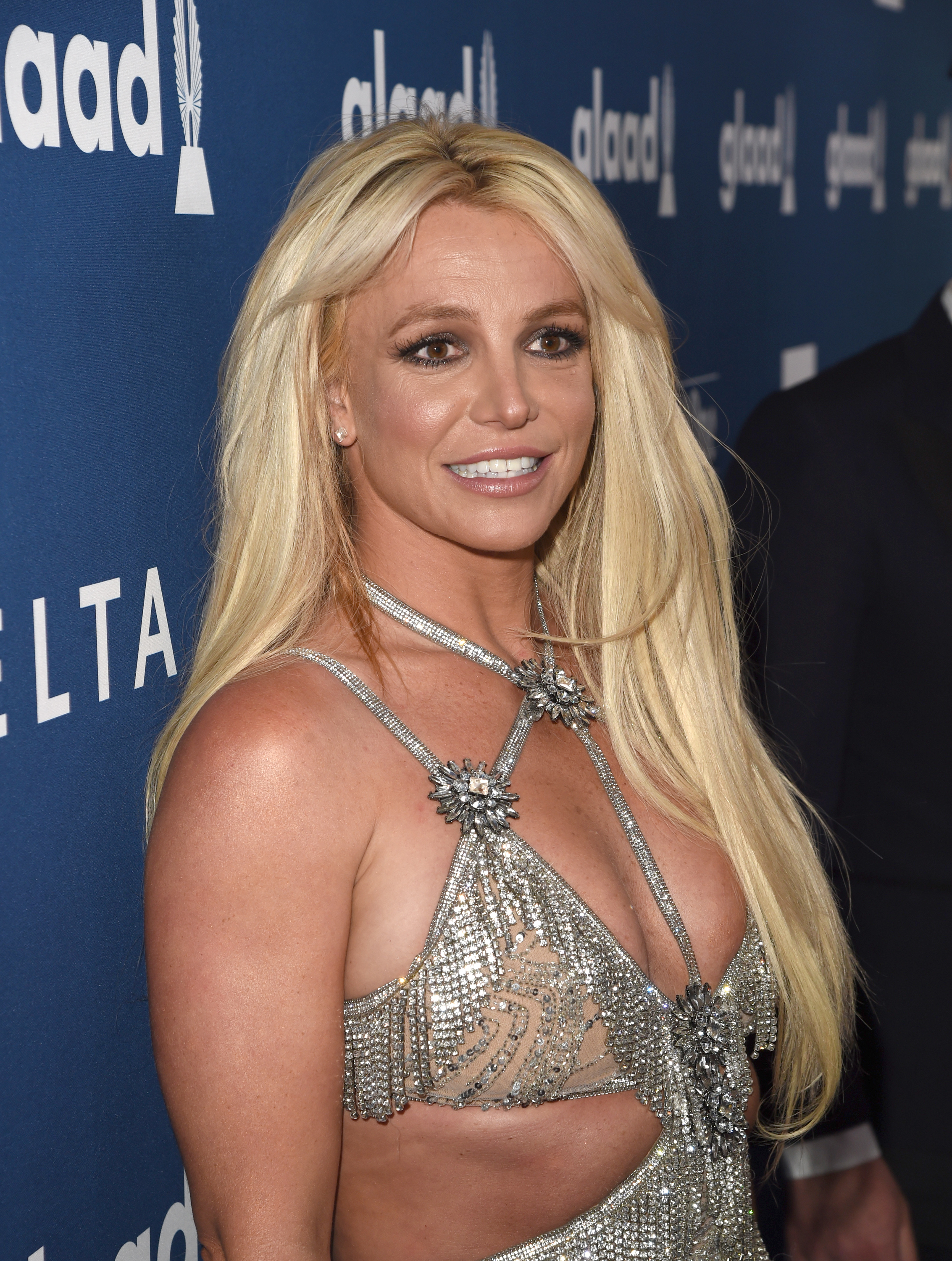 Close-up of Britney smiling at a press event