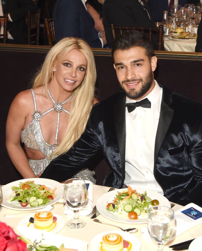 Close-up of Britney and Sam sitting at a dining table and smiling