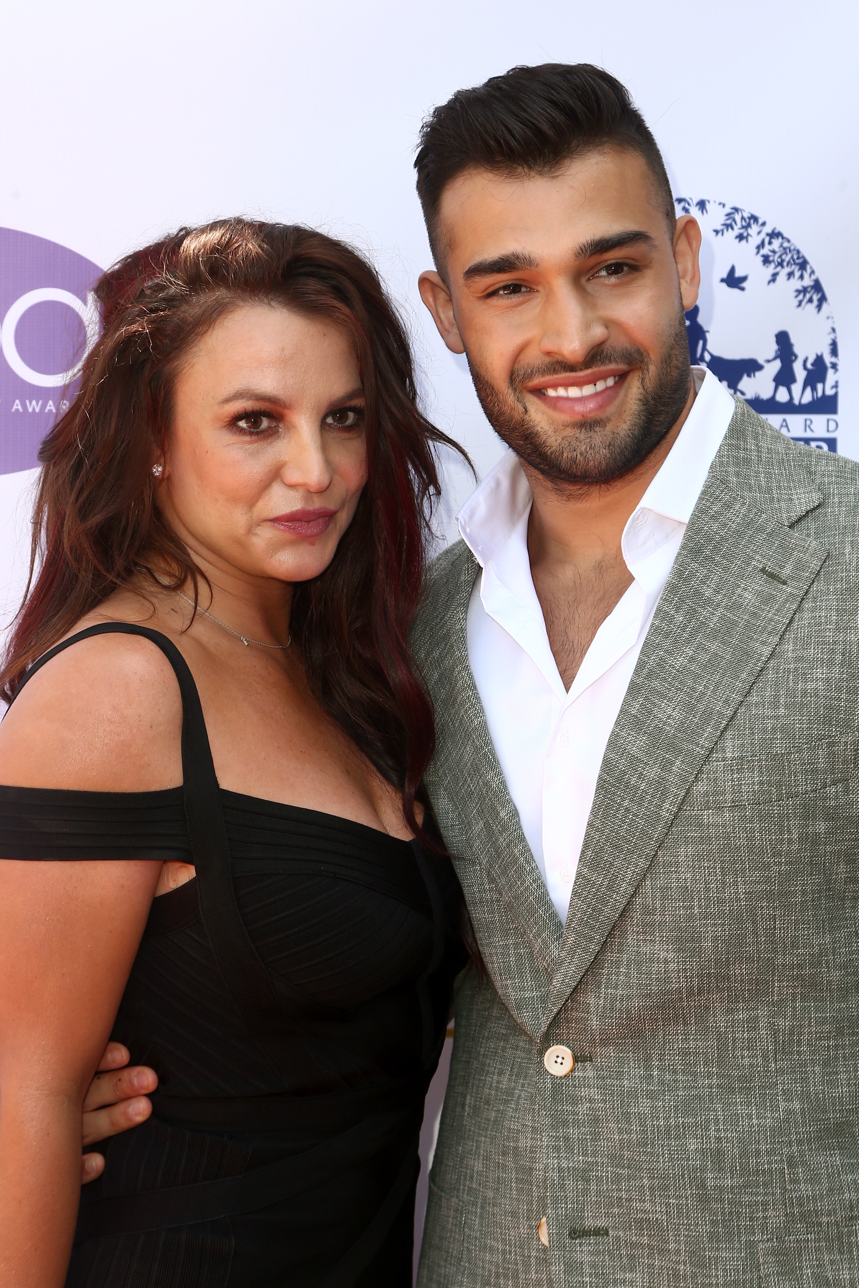 Close-up of Britney and Sam at a press event