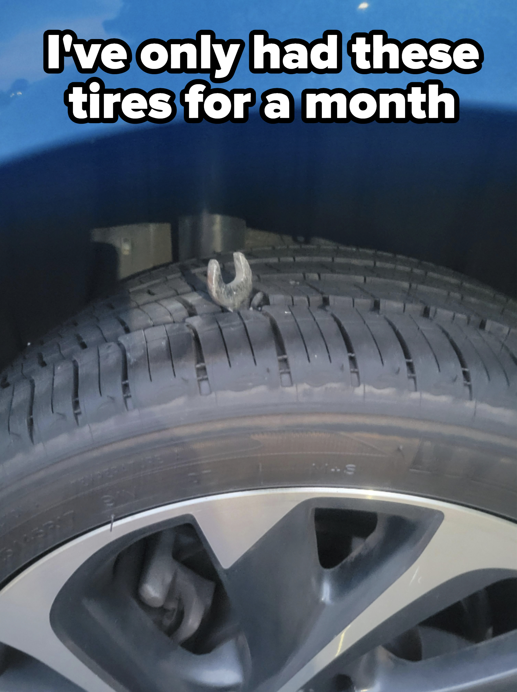 A wrench stuck in a tire