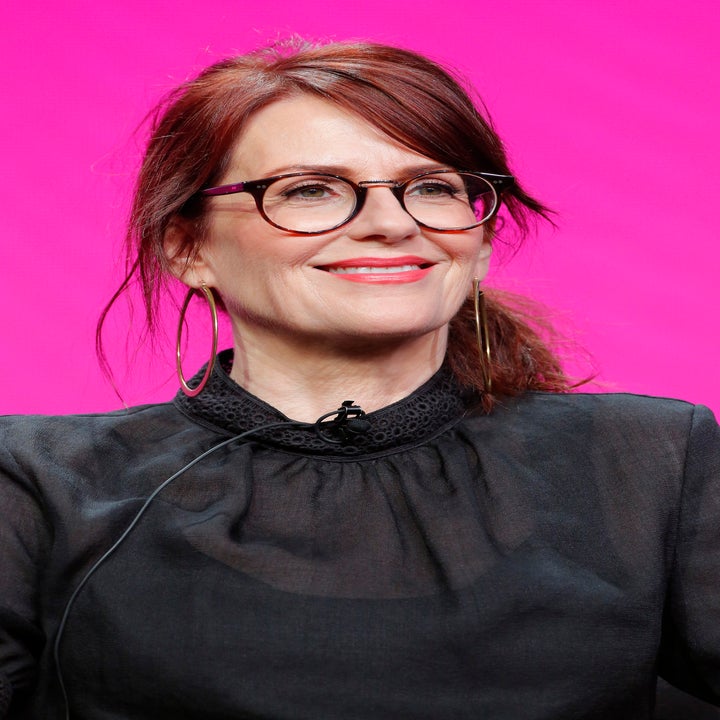 A closeup of Megan Mullally sitting on stage