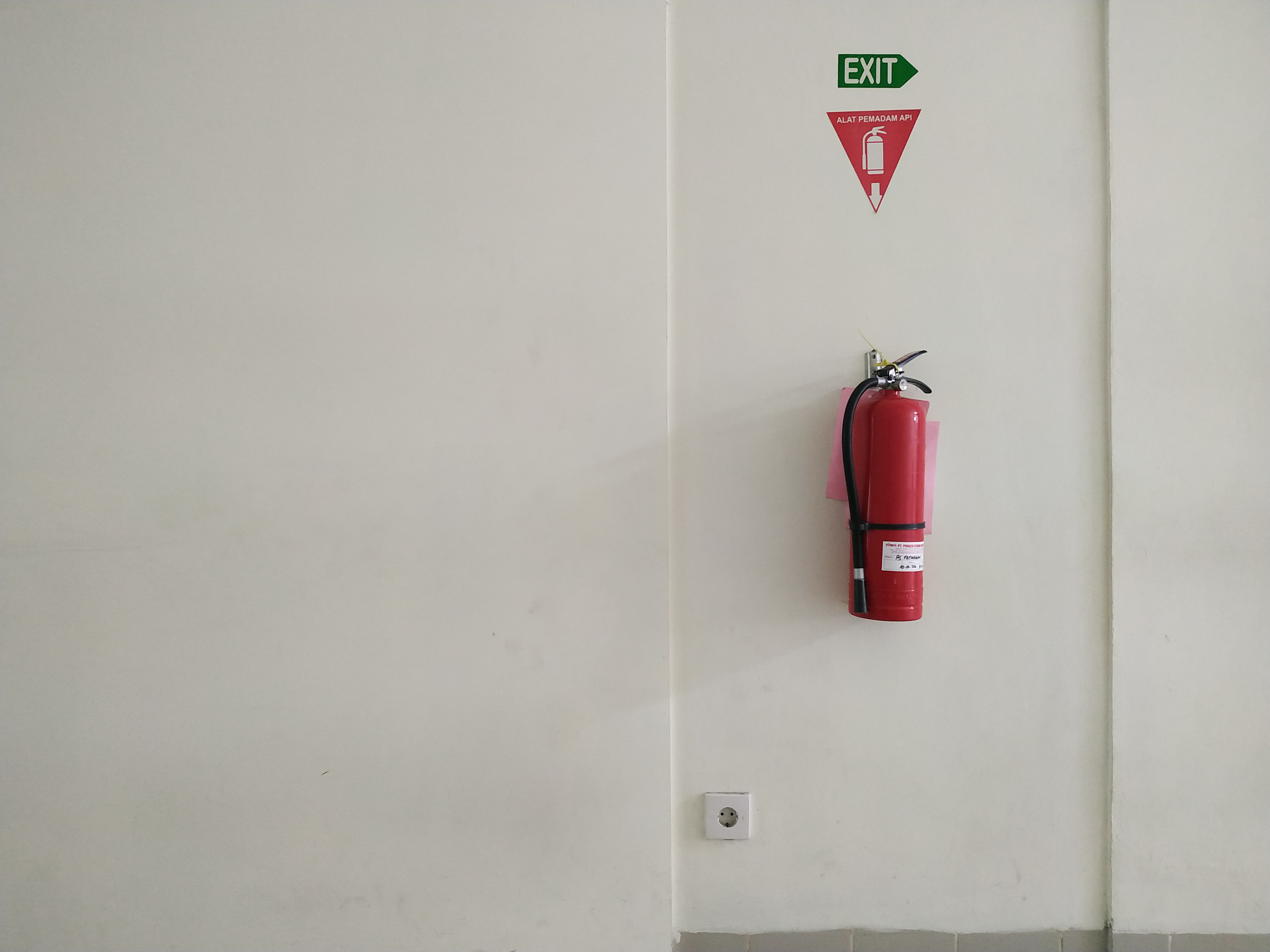 A fire extinguisher on a wall