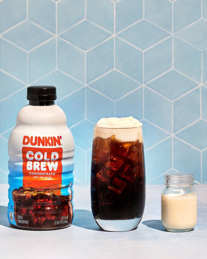 Imagery of dunkin&#x27; cold brew concentrate bottle alongside DIY Iced Latte with a Cold Cream Top and small jar of cream