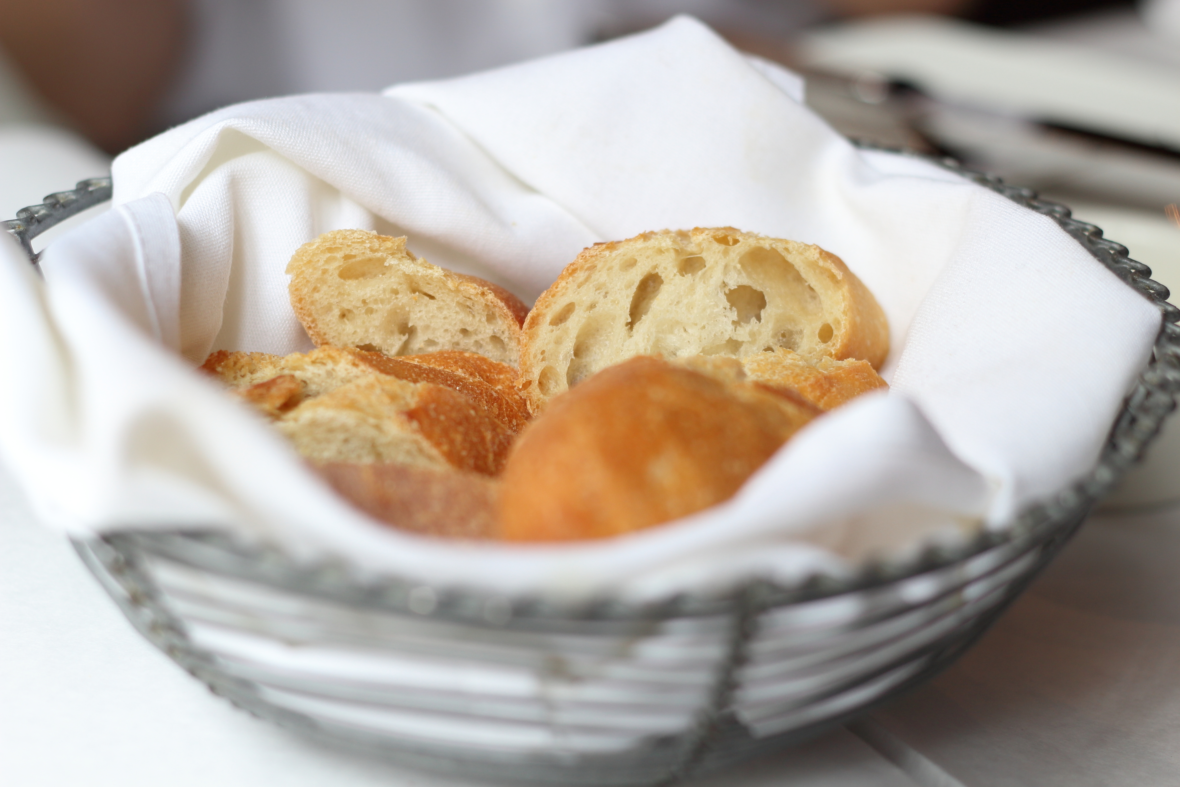 a bread basket on a restaurant table