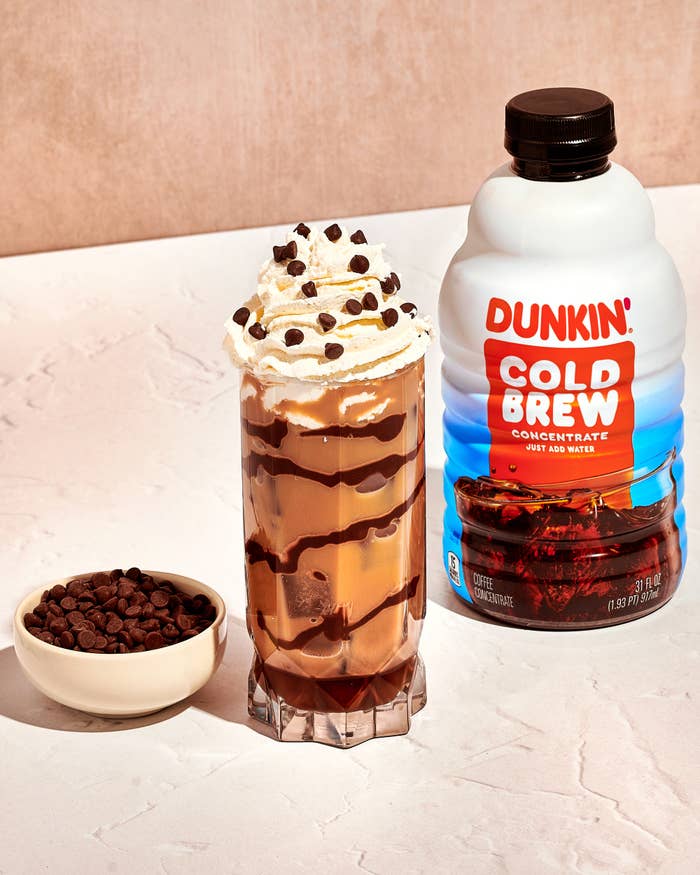 dunkin cold brew concentrate product imagery alongisde a glass of Chocolate Chip Cold Brew with chocolate drizzle and small bowl of chocolate chips