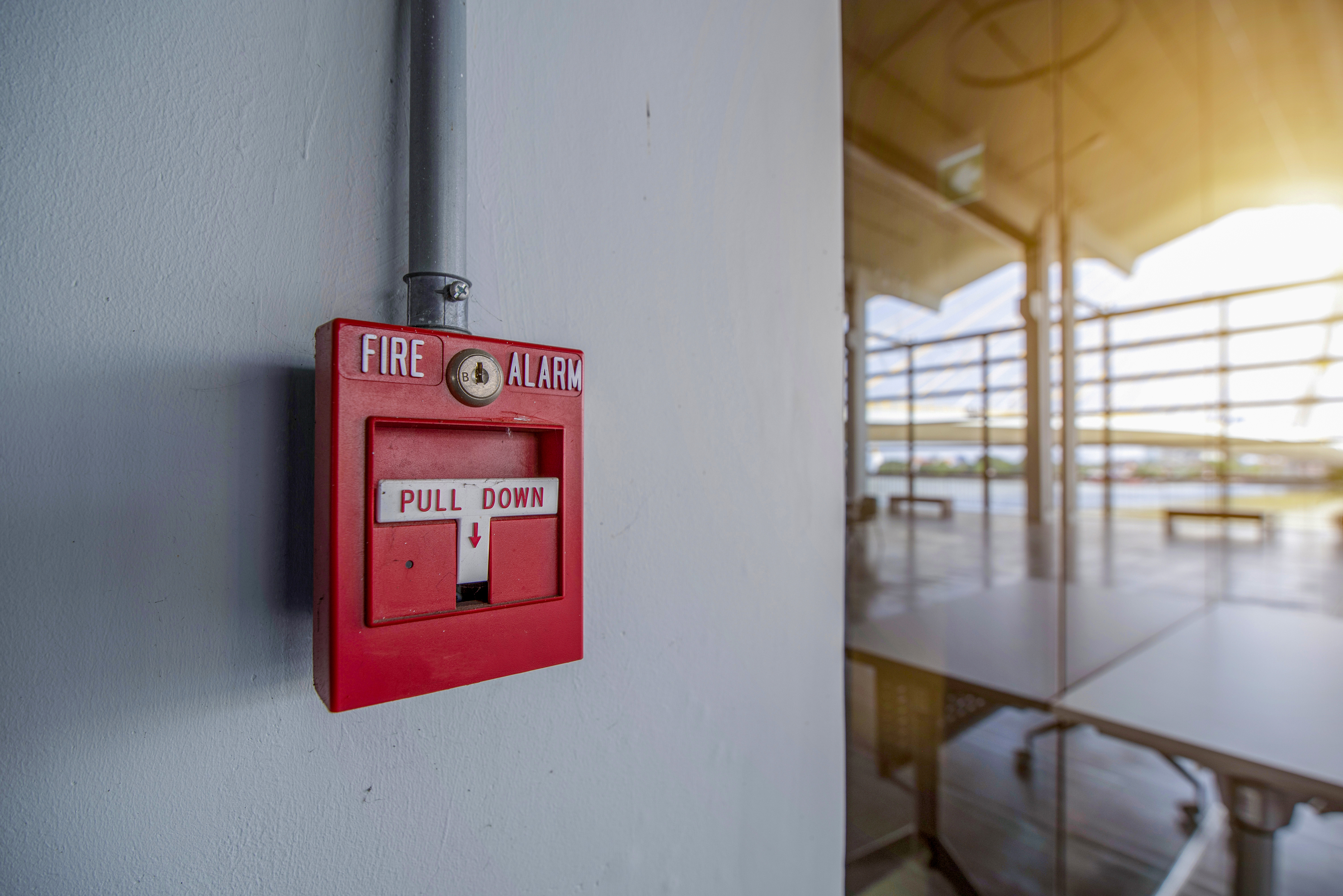 A fire alarm against a wall