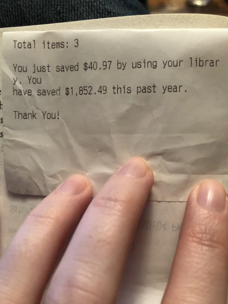 receipt showing the person has saved almost 2K from borrowing books in the year