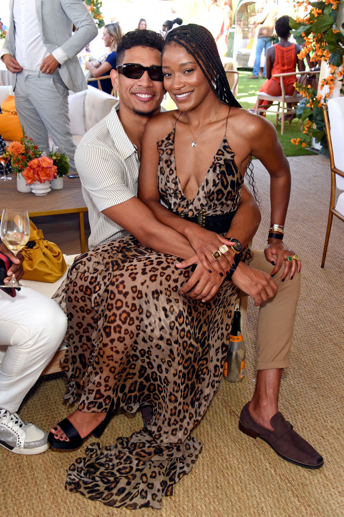 keke sitting on Darius' lap during an event