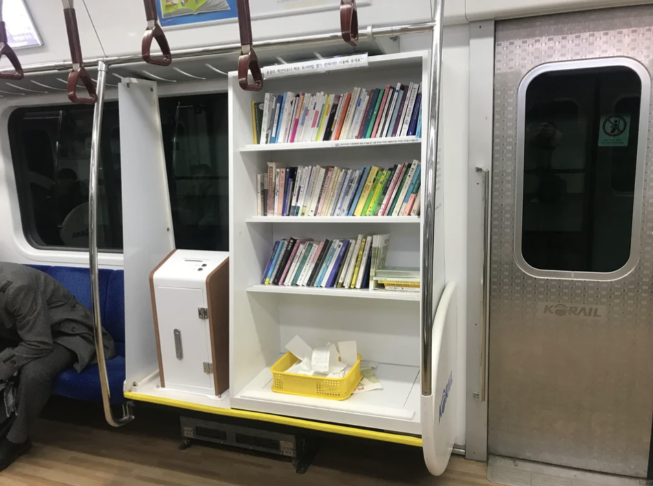 little library shelf in the subway car