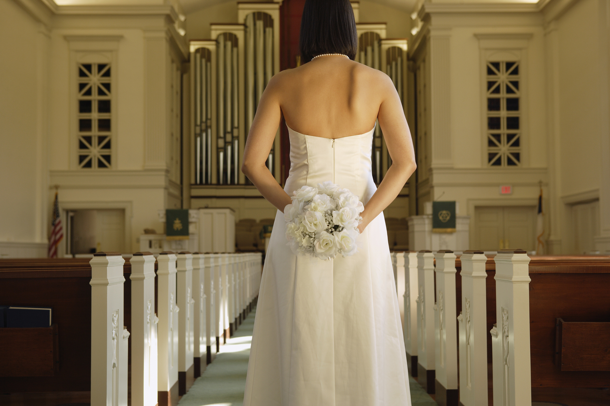 bride standing in an empty church