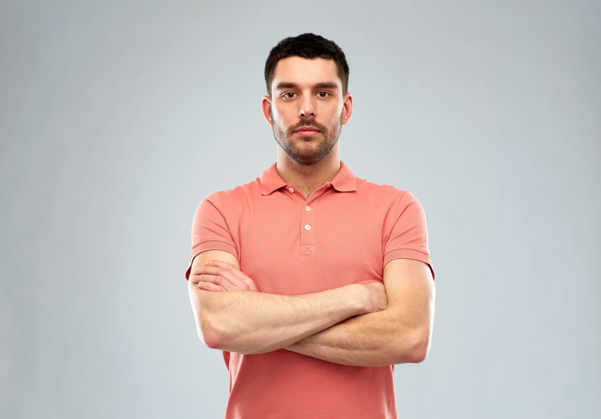 Serious-looking man with his hands folded