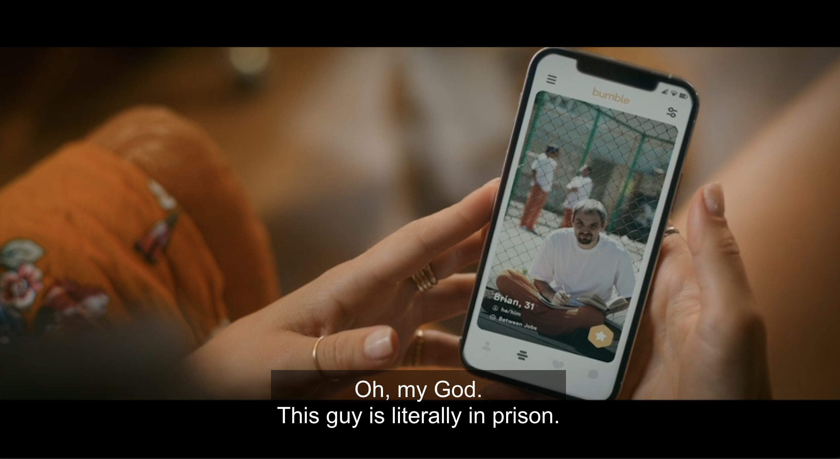 hand holding phone on bumble: &#x27;oh my god, this guy is literally in prison&#x27;