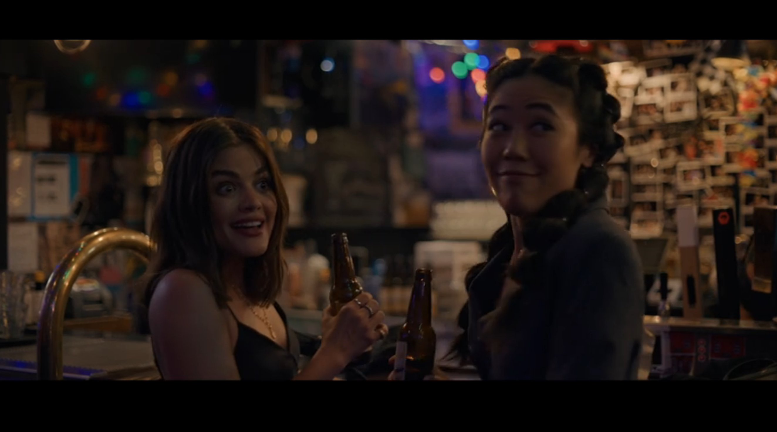 lucy hale and friend bump into someone at bar, look awkward