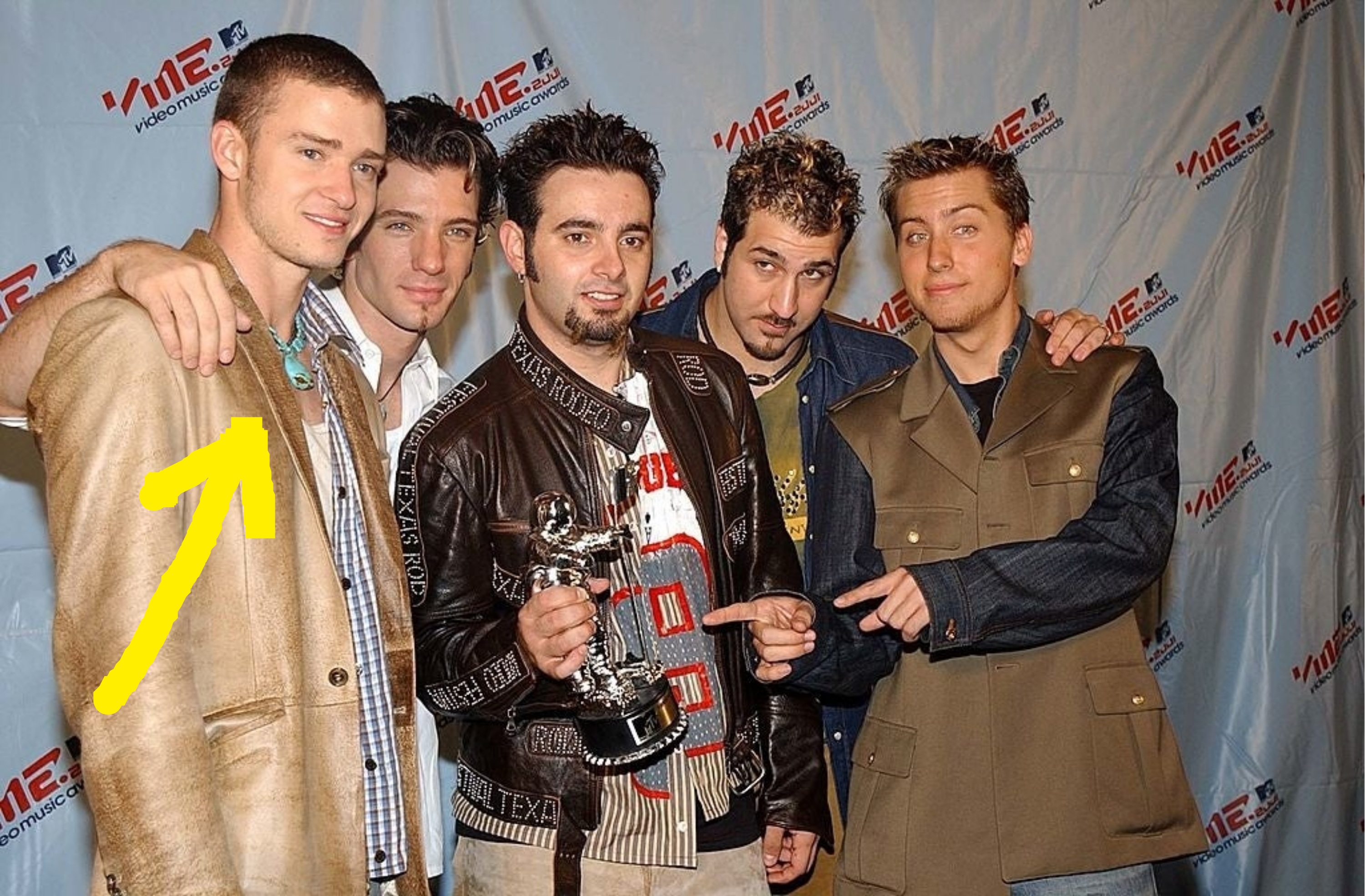 justin with the rest of nsync showing off their award