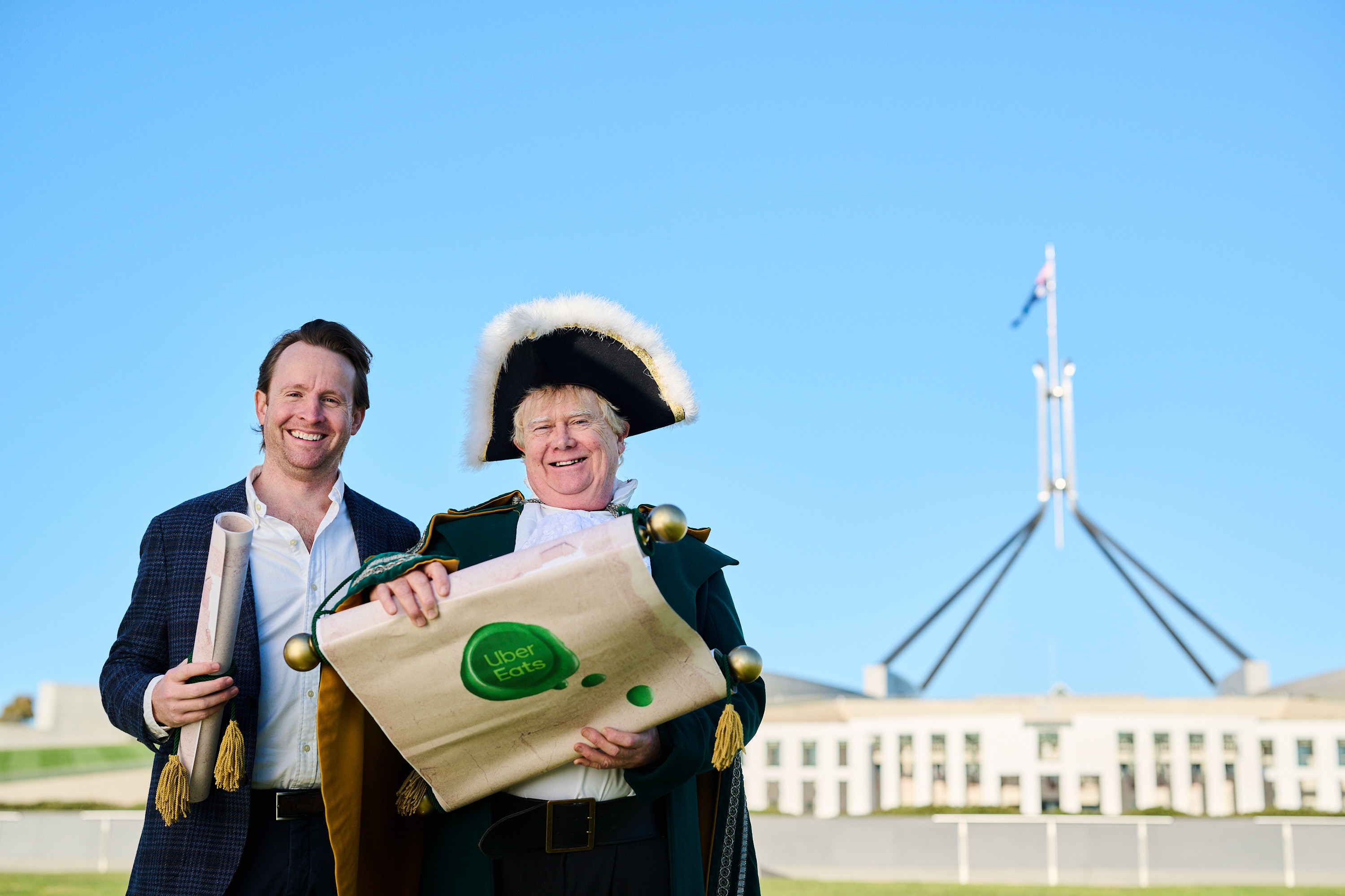 Town Crier outside Parliament House with the petition to rename Canberra CanBEERa and Uber Eats General Manager Retail, Lucas Groeneveld