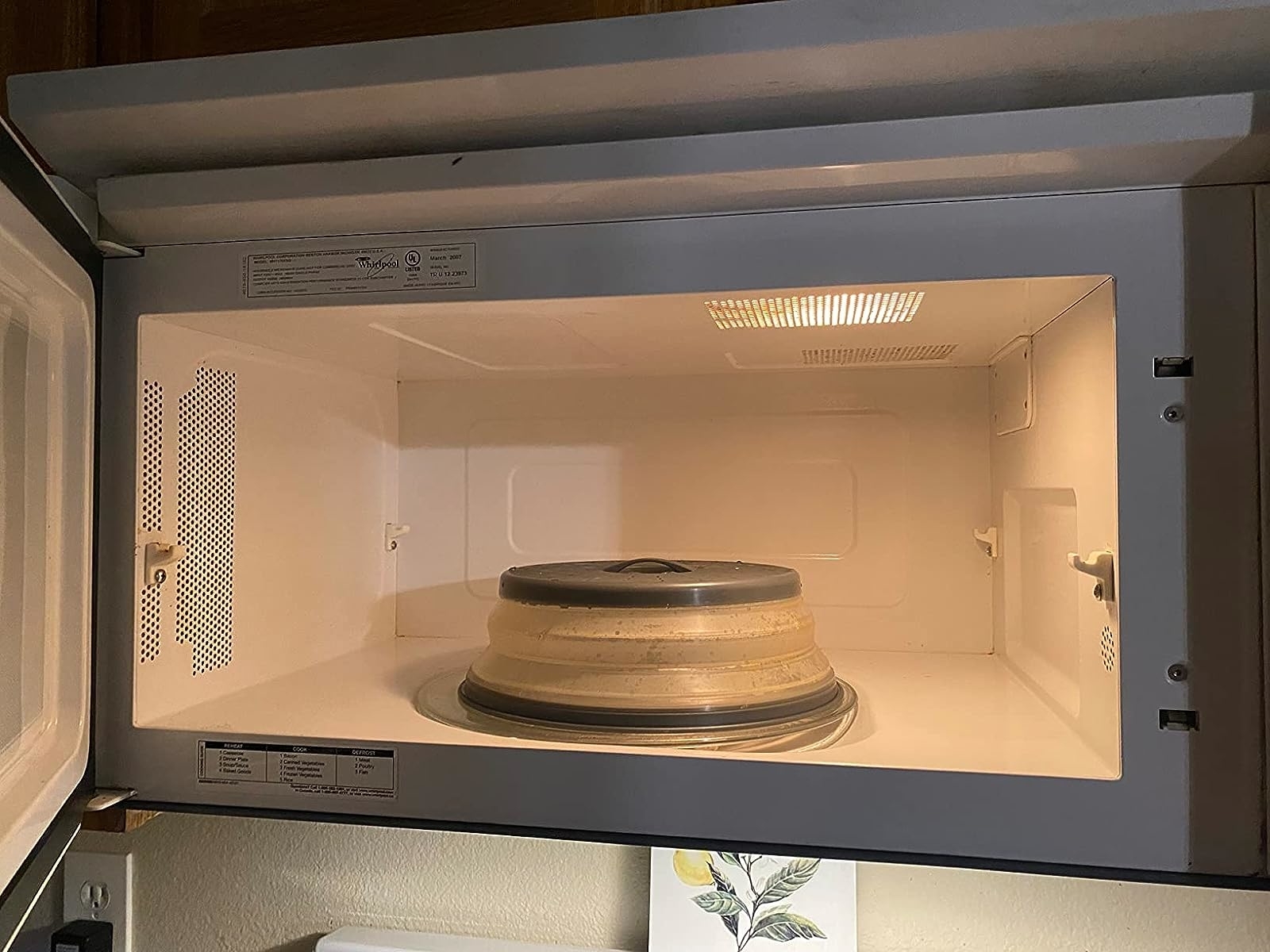 Reviewer image of the gray cover inside their microwave