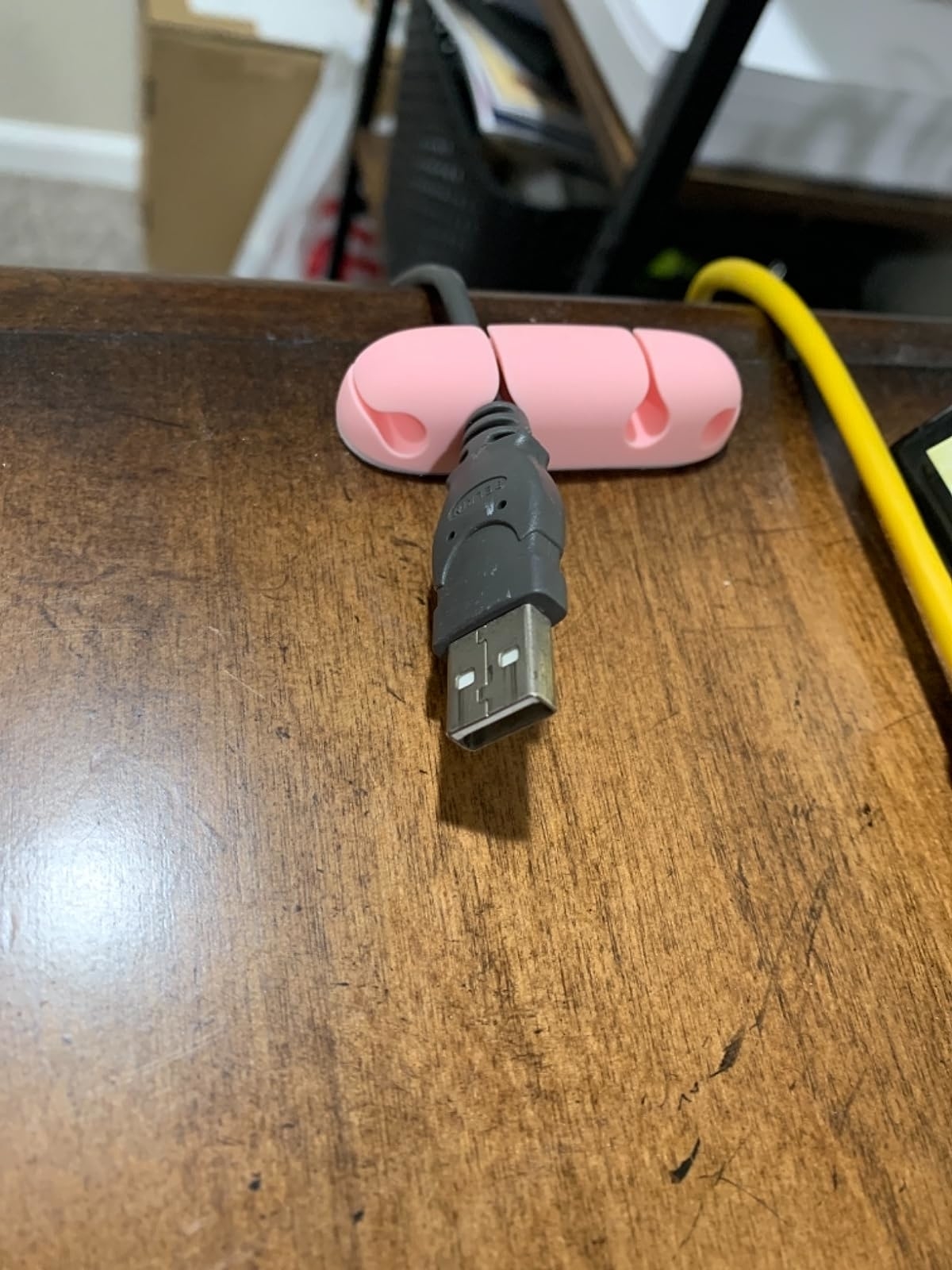 Reviewer image of a cord in the pink cord holder