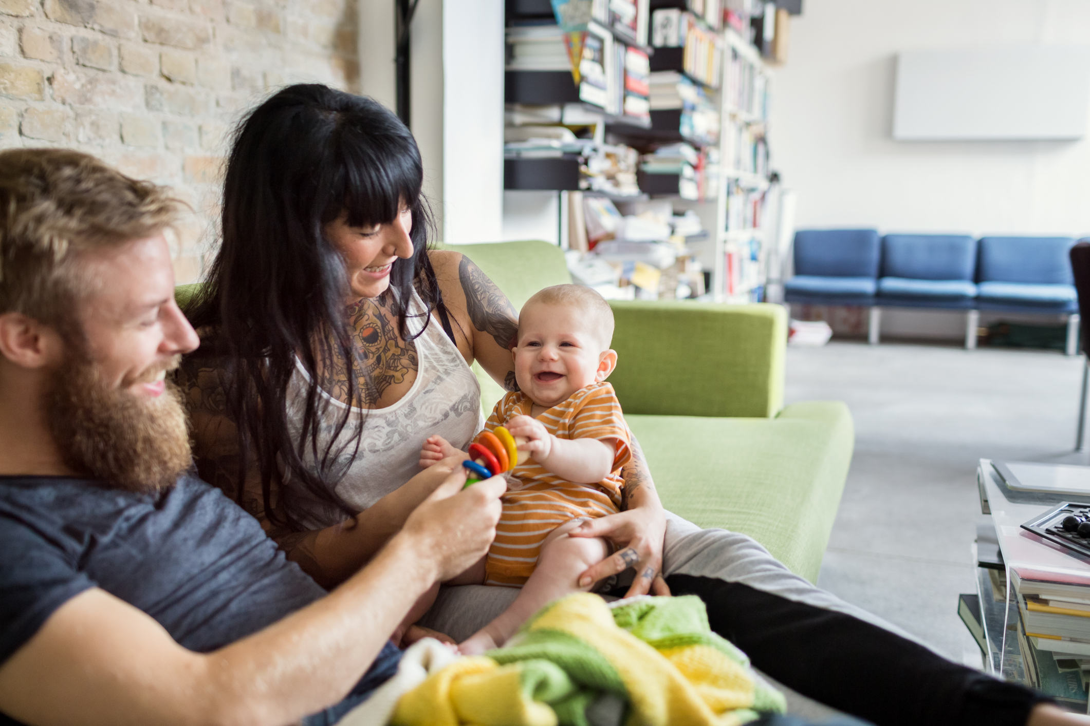 A couple playing with their baby