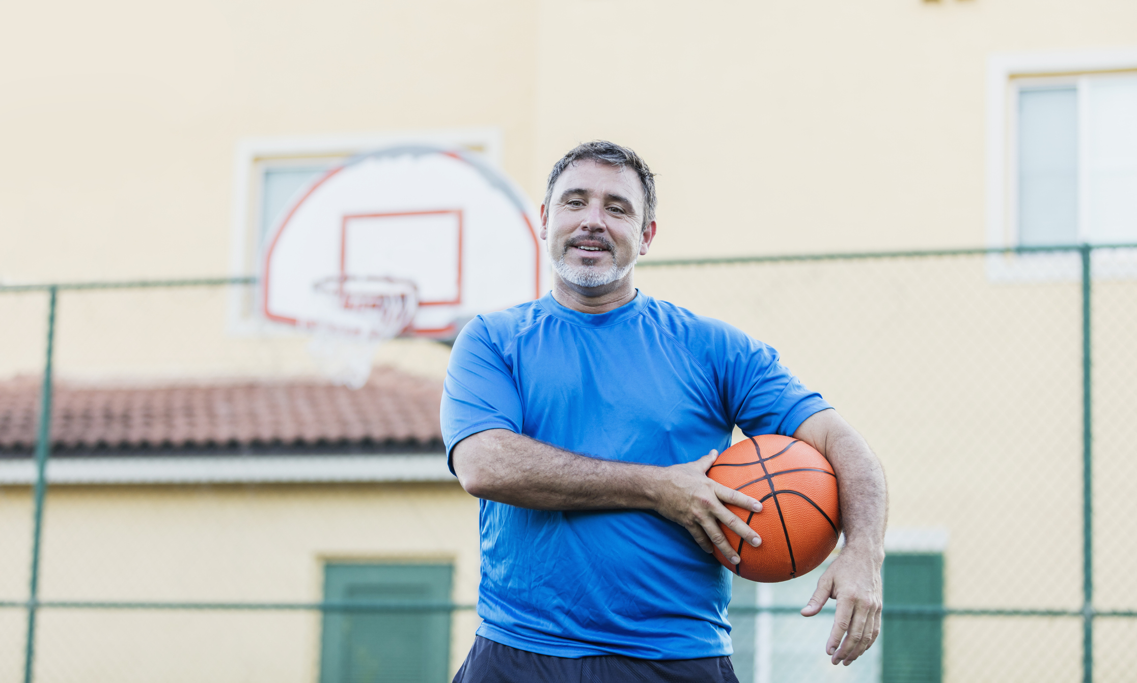 A man holding a basketball