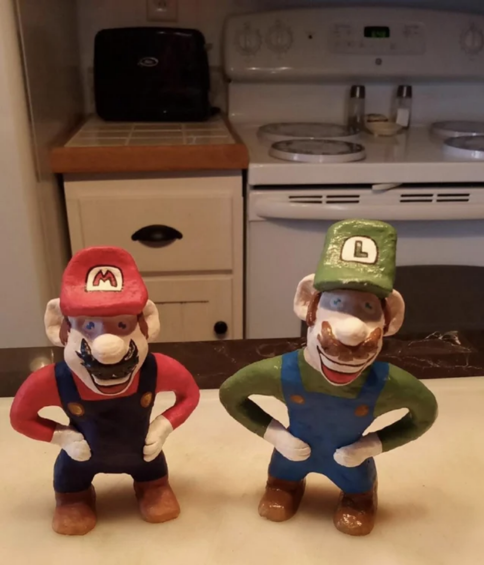 A very unsettling statue version of Mario and Luigi