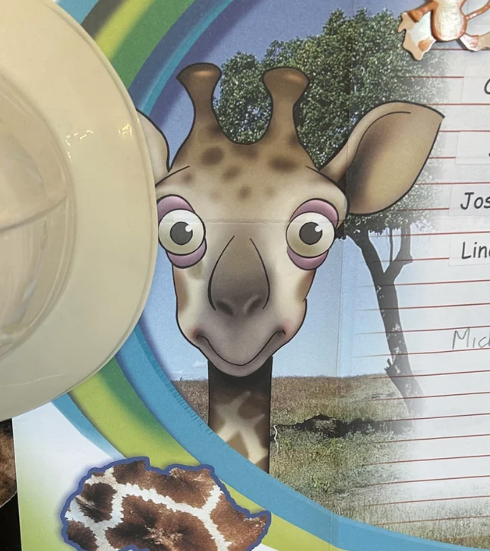A very creepy-looking drawing of a giraffe with WIDE-open eyes