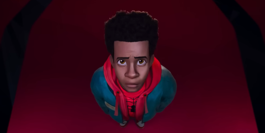 Miles in Spider-Man Across the Spiderverse looking at a costume