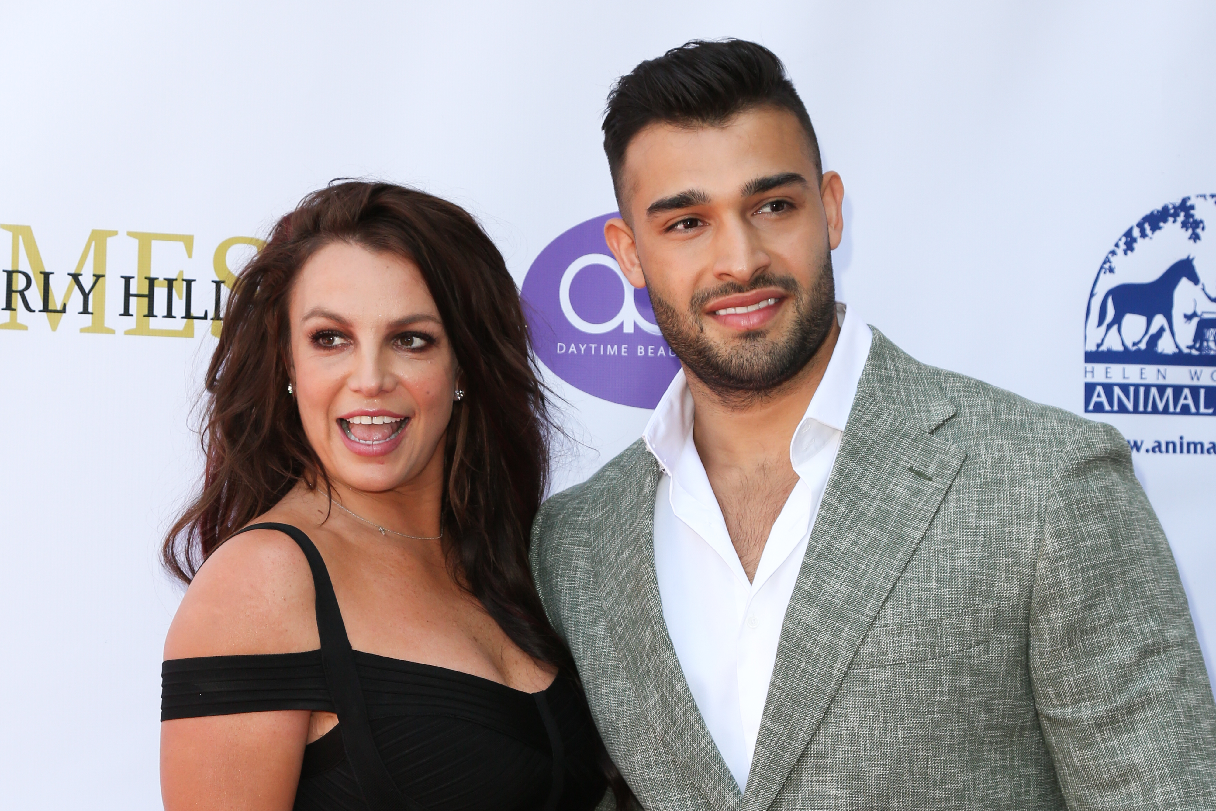 Close-up of Britney and Sam smiling at a media event