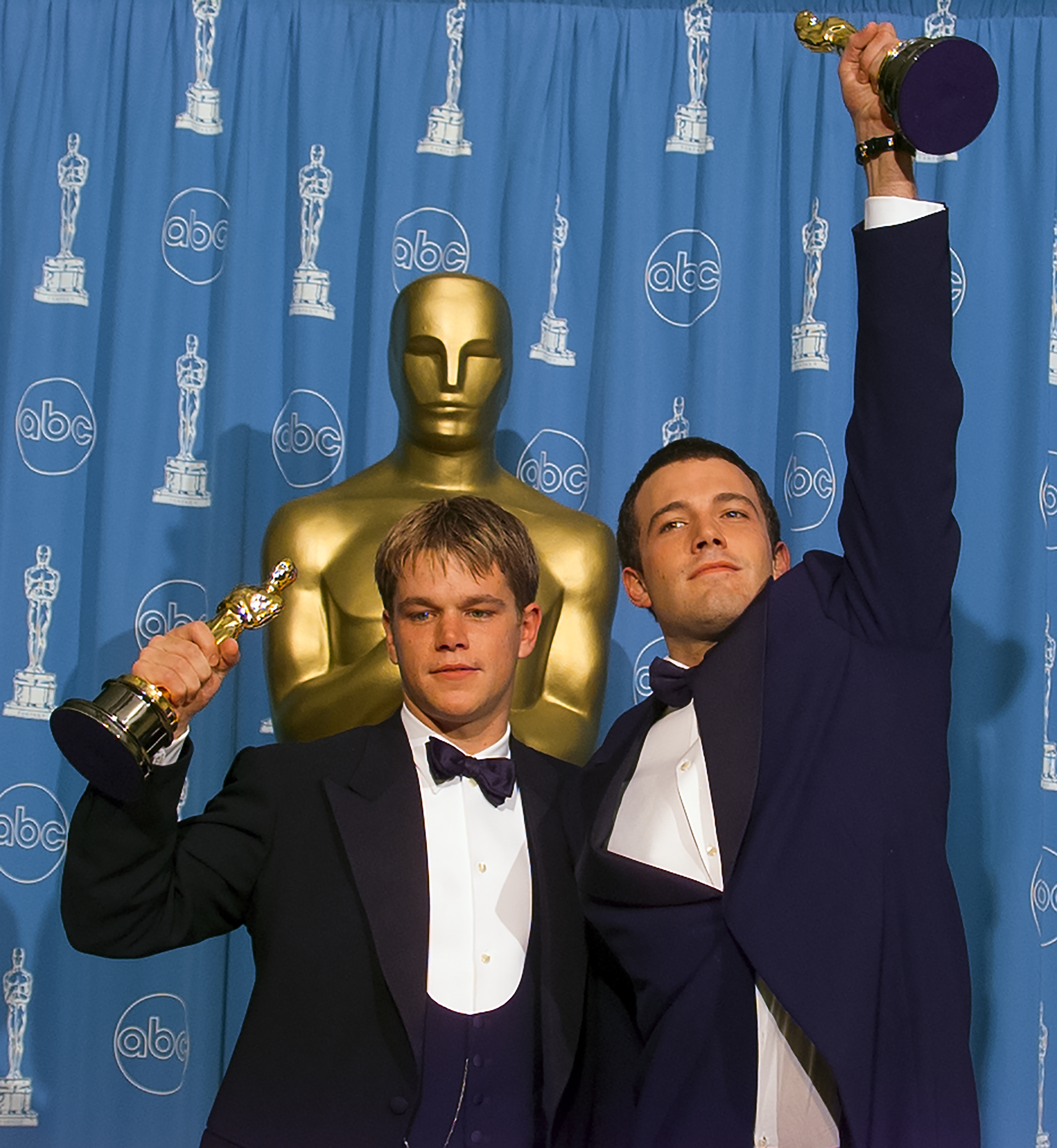Matt and Ben holding their Oscars