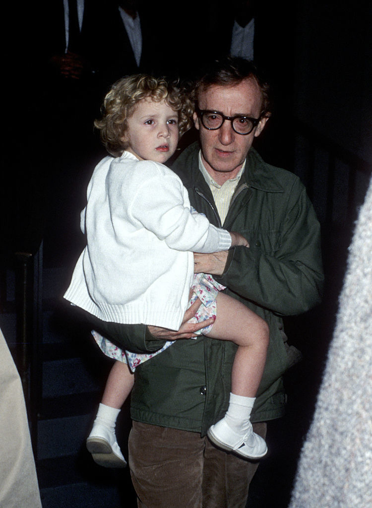 Woody holding Dylan as a toddler