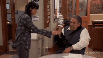 GIF of April throwing Jerry&#x27;s coffee on him