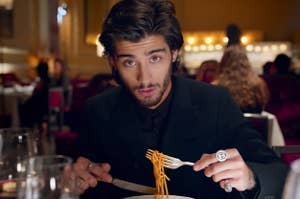 Zayn eating spaghetti in One Direction's Night Changes music video