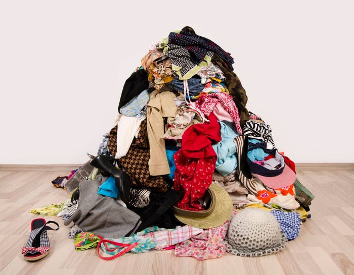 pile of clothes on wooden floor