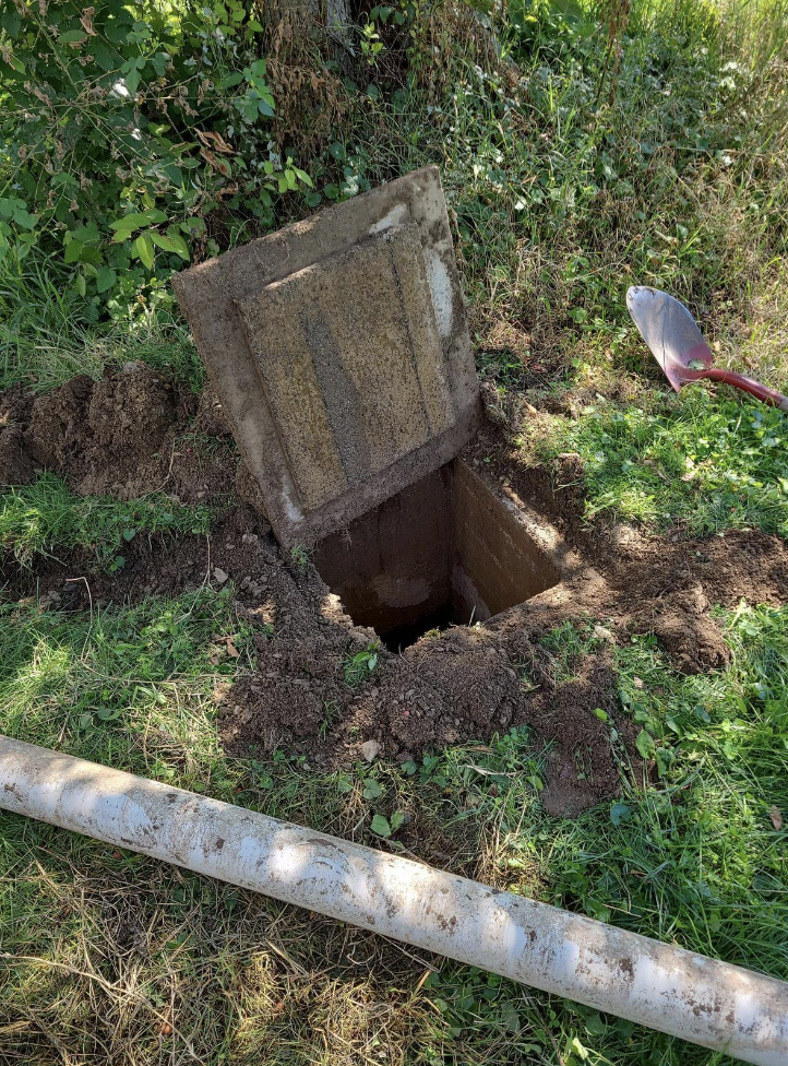 A dug hole in a garden
