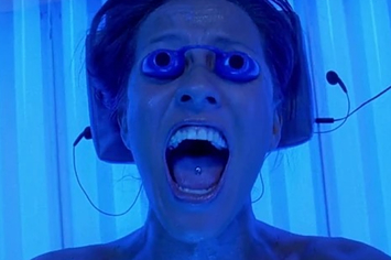 woman screaming in a tanning bed