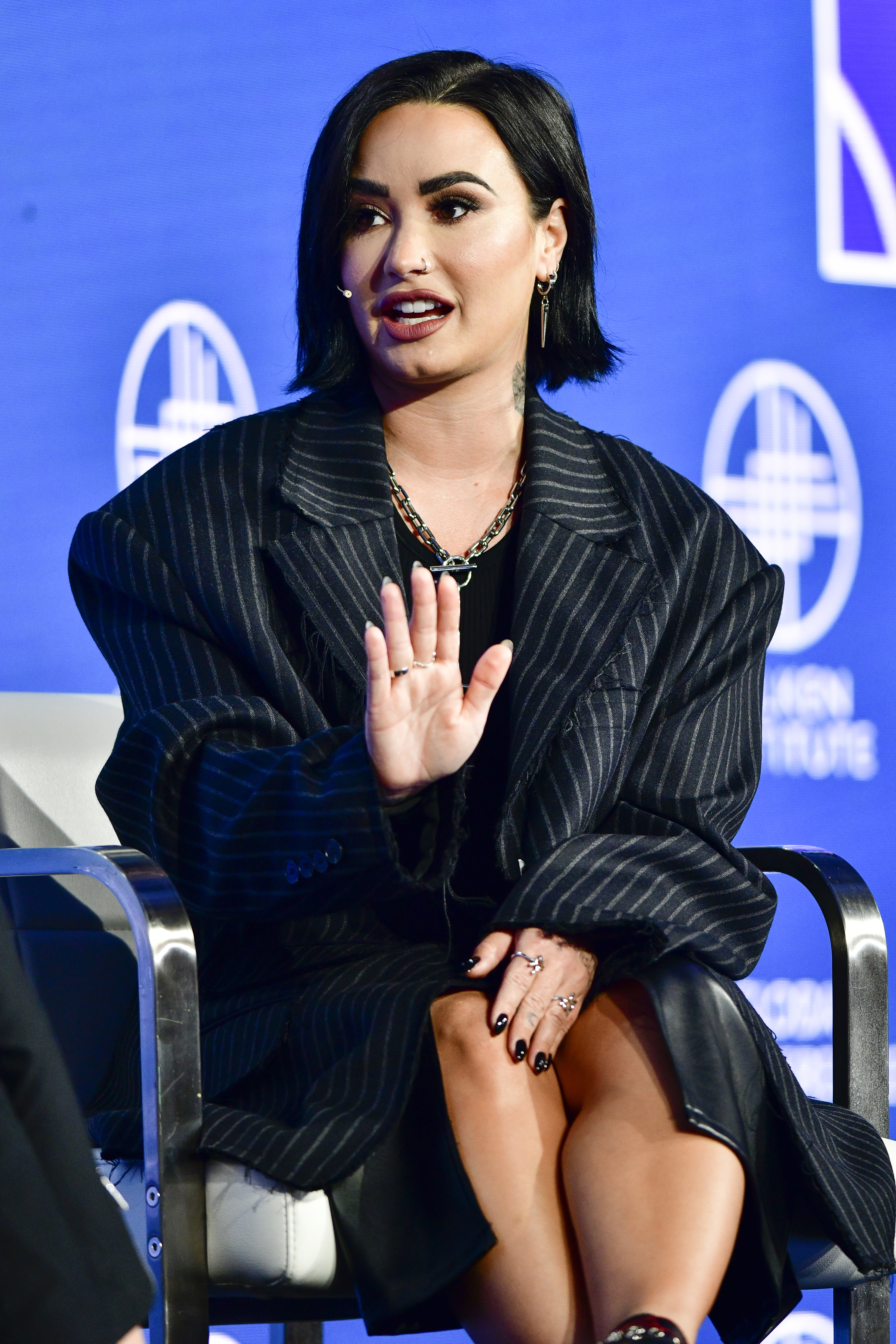 A closeup of Demi speaking during an interview