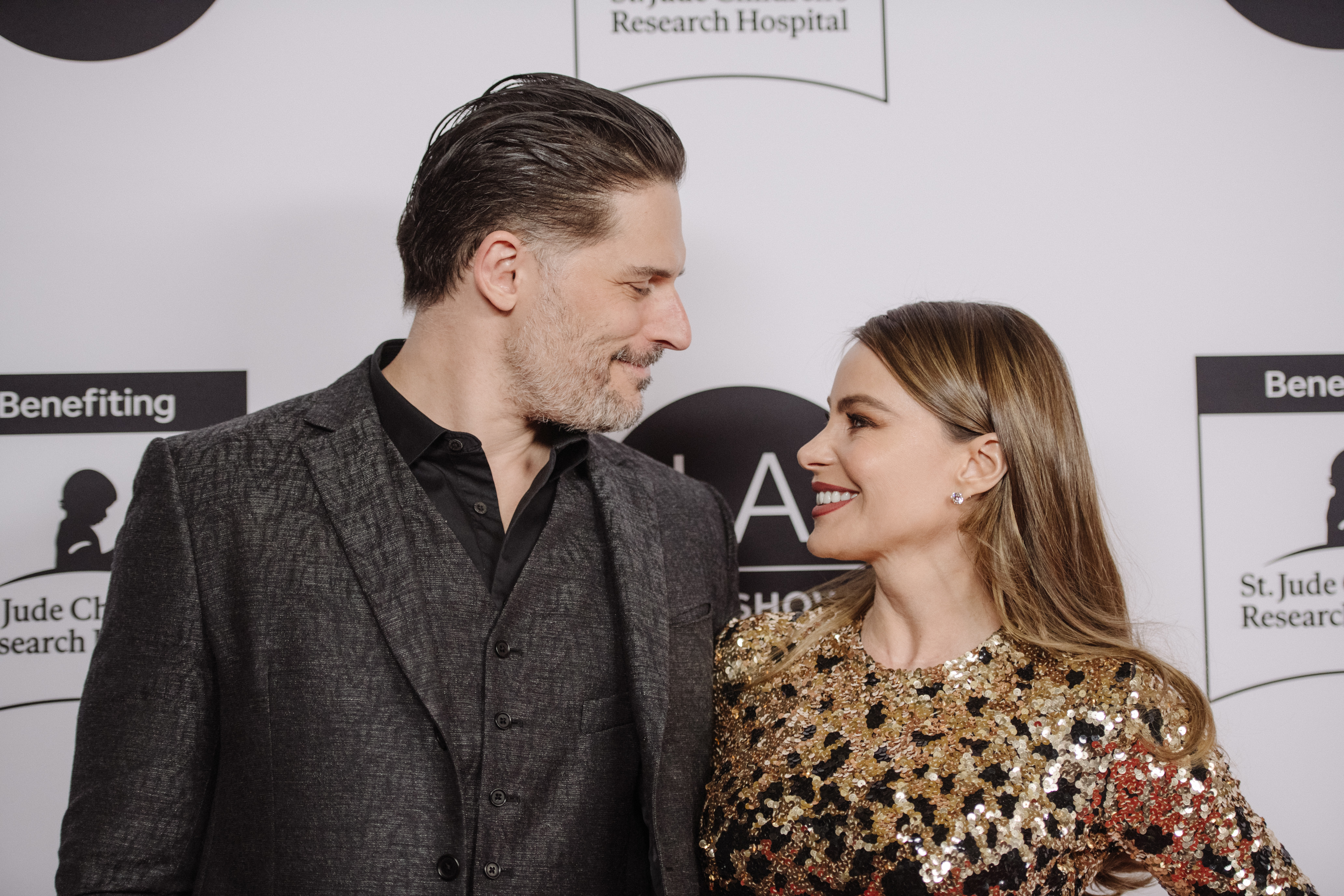 The former couple looking lovingly at one another as they stand on the red carpet