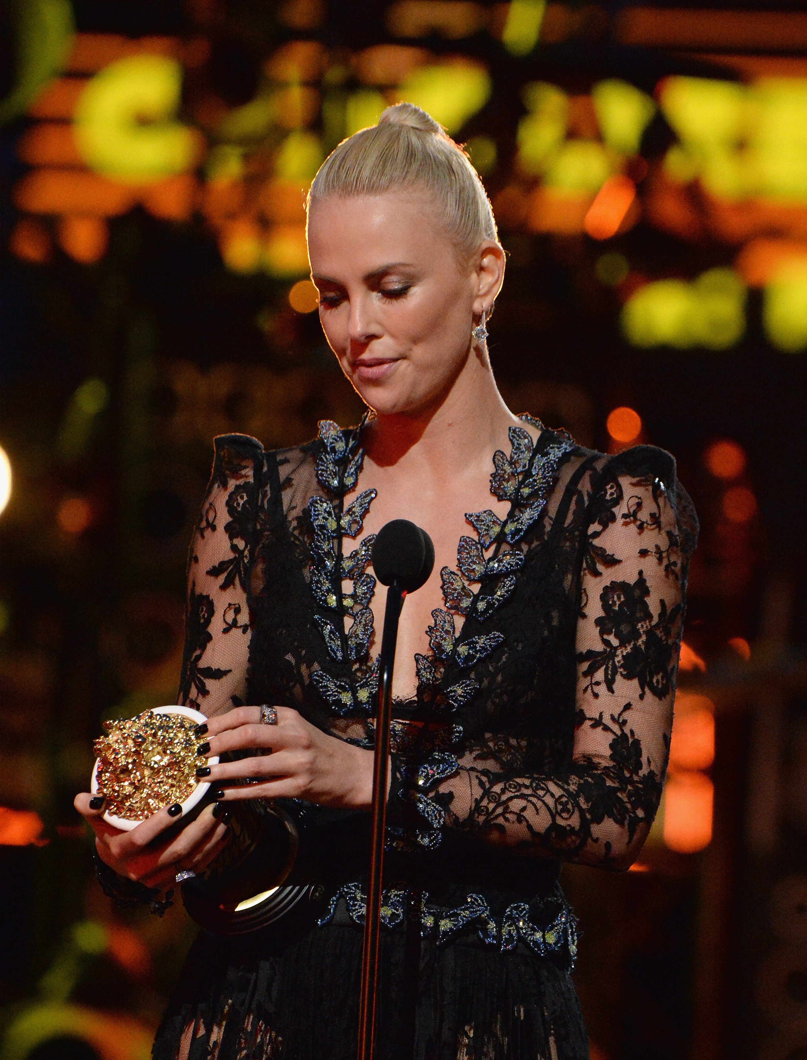 Charlize accepting an award